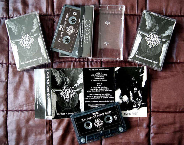 Oath (6) : The Dawn Of Satanic Might (Cass, Comp)